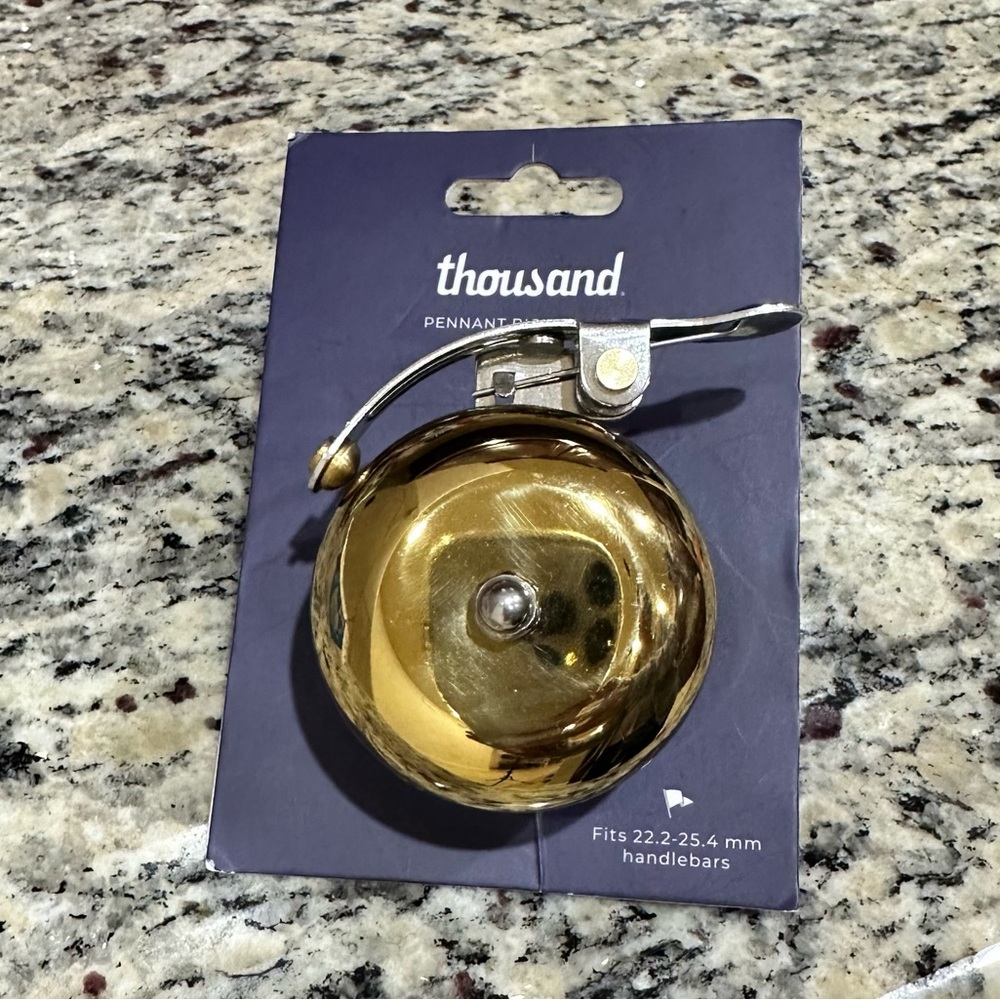 NWT Thousand Pennant Bicycle Bell ring. Color Brass